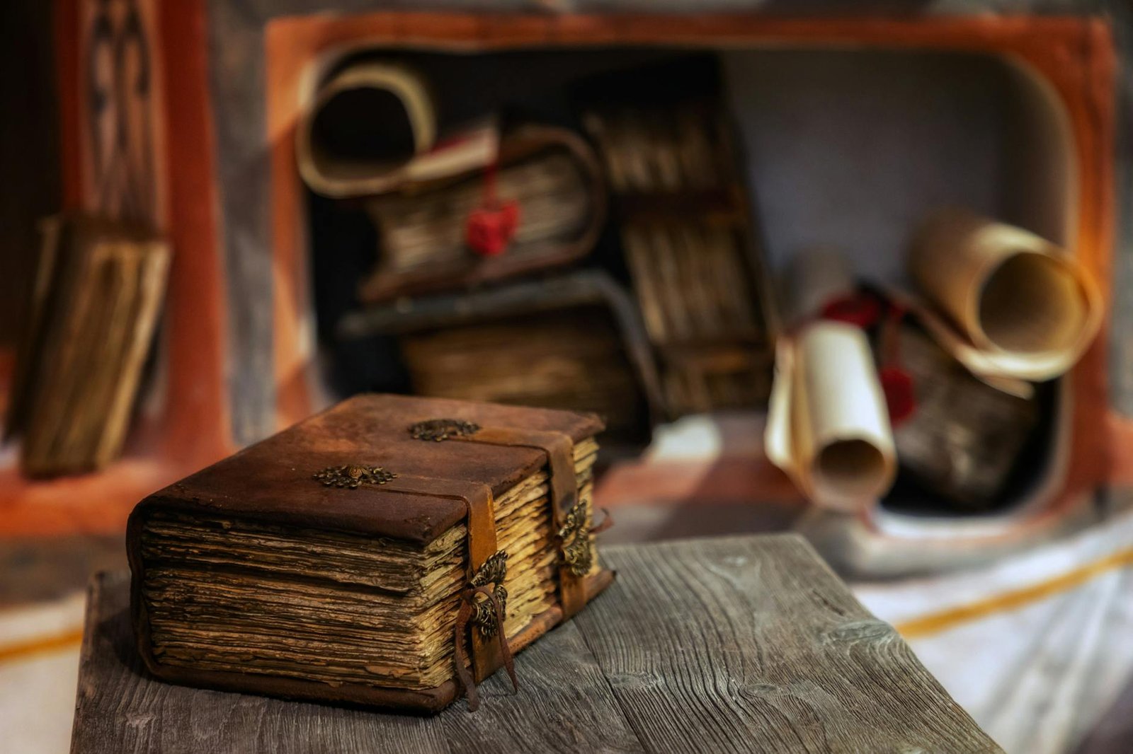 Antique leather-bound books on a wooden table representing scholarly tradition