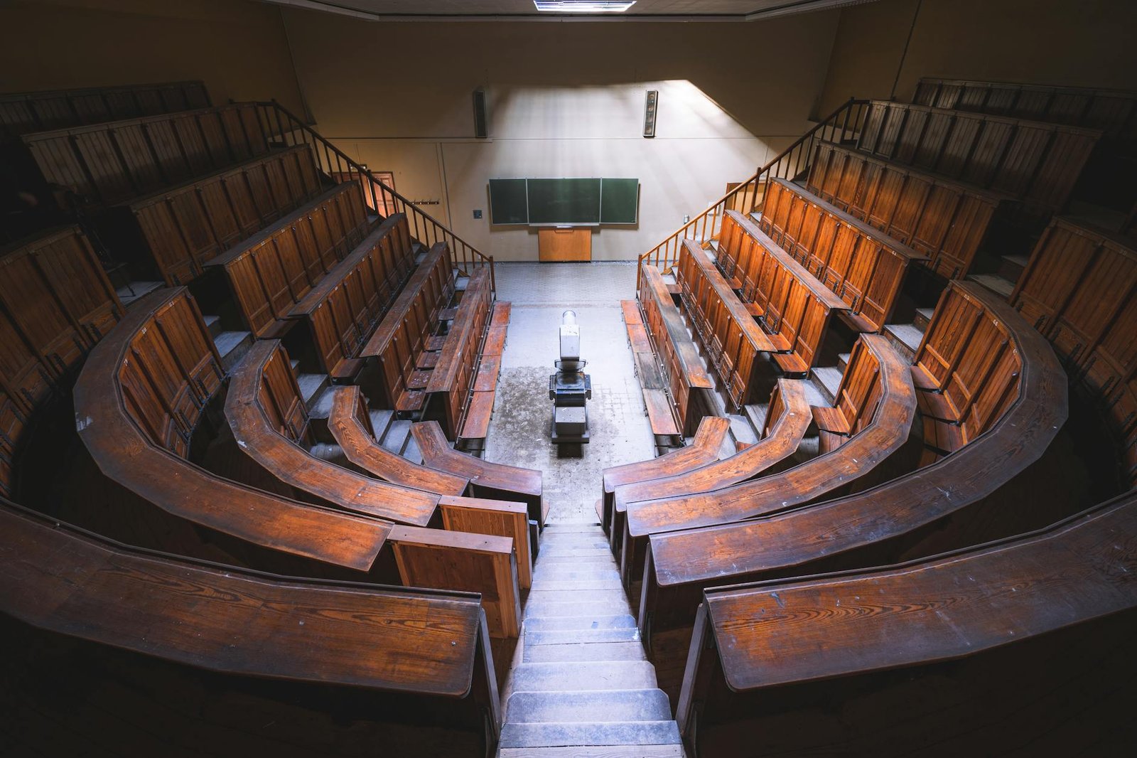 Vintage lecture hall viewed from above representing public lectures and debates